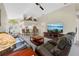 Open-concept living room boasts vaulted ceilings and a view of the entrance at 521 Bent Oak Ct, Spring Hill, FL 34609