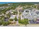 Aerial view of home and its location near local hospital, businesses, water views, and main thoroughfares at 556 Virginia St, Dunedin, FL 34698
