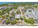 This aerial shot highlights the development's location near roads, trees, commercial buildings, and more at 556 Virginia St, Dunedin, FL 34698