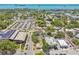 This aerial view shows the homes are close to roads, shops, tree lined roads, and beautiful bay views at 556 Virginia St, Dunedin, FL 34698