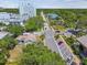 A strategic aerial view highlights the property's connectivity to the neighborhood and nearby commercial areas at 556 Virginia St, Dunedin, FL 34698