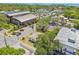 Aerial view of the property, showcasing the surrounding community, nearby facilities, and landscaping at 556 Virginia St, Dunedin, FL 34698
