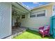 Charming back patio with cozy seating, and pleasant outdoor view at 556 Virginia St, Dunedin, FL 34698