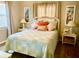 Serene bedroom featuring a comfortable bed with decorative pillows and side tables at 556 Virginia St, Dunedin, FL 34698