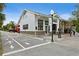 Historical building with a white exterior, brick accents, and vintage architecture at 556 Virginia St, Dunedin, FL 34698