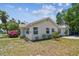 Charming home with well-manicured landscaping and attractive exterior details at 556 Virginia St, Dunedin, FL 34698