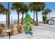Colorful dolphin statue near a pier, adding a playful touch to the scenic Dunedin, Florida waterfront at 556 Virginia St, Dunedin, FL 34698
