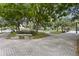 Picturesque park featuring paved walkways and lush trees providing plenty of shade at 556 Virginia St, Dunedin, FL 34698