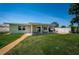 Well-manicured backyard featuring a covered patio perfect for outdoor entertaining at 5785 15Th N Ave, St Petersburg, FL 33710