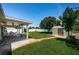 Spacious backyard featuring a covered patio, a shed, and a well-maintained lawn at 5785 15Th N Ave, St Petersburg, FL 33710