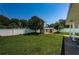 Beautifully landscaped backyard with a storage shed, mature trees, and well-manicured lawn at 5785 15Th N Ave, St Petersburg, FL 33710