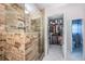 Stunning bathroom featuring a glass shower and an adjacent walk-in closet at 5785 15Th N Ave, St Petersburg, FL 33710