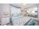 Bright, comfortable bedroom featuring a large mirrored closet and ceiling fan at 5785 15Th N Ave, St Petersburg, FL 33710