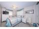 Bright, comfortable bedroom with a ceiling fan, tile floor, and ample natural light at 5785 15Th N Ave, St Petersburg, FL 33710