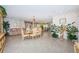 Open-concept dining and living area with chandelier lighting, stylish decor, and tile flooring at 5785 15Th N Ave, St Petersburg, FL 33710