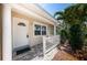 Inviting entryway featuring a white front door, decorative railing, and well-maintained landscaping at 5785 15Th N Ave, St Petersburg, FL 33710