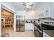 Open kitchen design with stainless steel appliances, granite countertops, and adjacent dining area at 5785 15Th N Ave, St Petersburg, FL 33710