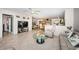 Spacious living room featuring an open floor plan, light tile, and comfortable seating at 5785 15Th N Ave, St Petersburg, FL 33710