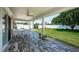 Covered patio with outdoor seating and a spacious backyard perfect for gatherings at 5785 15Th N Ave, St Petersburg, FL 33710