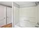 Bathroom featuring a shower over tub and convenient linen closet nearby at 6006 N Highland Ave, Tampa, FL 33604