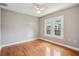 Bedroom with hardwood floors, a ceiling fan, and natural light at 6006 N Highland Ave, Tampa, FL 33604