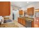 Updated kitchen features granite countertops and stainless steel appliances at 6006 N Highland Ave, Tampa, FL 33604