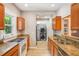 Well-equipped kitchen with granite countertops, modern appliances, and a convenient laundry area at 6006 N Highland Ave, Tampa, FL 33604