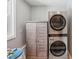 Well-lit laundry room featuring modern, stainless steel washer and dryer set at 6006 N Highland Ave, Tampa, FL 33604