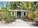 Backyard shed surrounded by lush landscaping and a brick path at 6006 N Highland Ave, Tampa, FL 33604