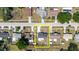 Overhead view of the house in context with surrounding neighborhood and green spaces at 6110 16Th St, Zephyrhills, FL 33542