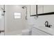Updated bathroom featuring a rainfall shower head and white subway tile design at 6110 16Th St, Zephyrhills, FL 33542