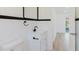 Bright bathroom featuring a modern vanity with black hardware and a sleek faucet at 6110 16Th St, Zephyrhills, FL 33542