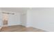 Bright bedroom featuring modern flooring and a sliding barn door to an ensuite bathroom at 6110 16Th St, Zephyrhills, FL 33542