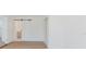 Bedroom with modern flooring and a sliding barn door to an ensuite bathroom at 6110 16Th St, Zephyrhills, FL 33542
