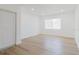 Spacious bedroom with modern flooring, a large window, and ample natural light at 6110 16Th St, Zephyrhills, FL 33542