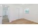 Inviting bedroom with light wood flooring and closet space, ready for personalization at 6110 16Th St, Zephyrhills, FL 33542