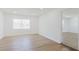 Bright bedroom with modern flooring and a view to an adjacent bathroom at 6110 16Th St, Zephyrhills, FL 33542