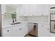 Bright kitchen featuring quartz countertops, stainless steel appliances, and designer tile backsplash at 6110 16Th St, Zephyrhills, FL 33542