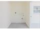Functional laundry room features utility connections and a window to let in natural light at 6110 16Th St, Zephyrhills, FL 33542