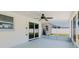 Inviting screened patio with ceiling fan offers a comfortable space for outdoor relaxation and entertaining at 6110 16Th St, Zephyrhills, FL 33542