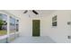 Charming screened-in porch features a ceiling fan, offering a relaxing space with backyard views at 6110 16Th St, Zephyrhills, FL 33542