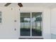 Cozy outdoor patio with sliding glass doors, perfect for enjoying the backyard view in any weather at 6110 16Th St, Zephyrhills, FL 33542