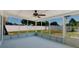 Spacious screened lanai overlooking the backyard, offering a seamless transition between indoor and outdoor living at 6110 16Th St, Zephyrhills, FL 33542