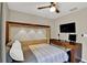 Functional bedroom featuring a Murphy bed with built-in lighting and desk, maximizing space and style at 7114 Fern Garden Ct, Sun City Center, FL 33573