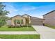 Charming single-story home with well-manicured lawn and inviting curb appeal at 7114 Fern Garden Ct, Sun City Center, FL 33573