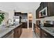 Stylish kitchen with granite counters, stainless steel appliances, and an island with seating and modern finishes at 7114 Fern Garden Ct, Sun City Center, FL 33573