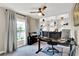 Inviting home office with a large window, custom built-ins, and a modern desk at 7114 Fern Garden Ct, Sun City Center, FL 33573