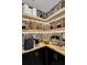 Well-organized pantry with open shelves, decorative wallpaper, and ample storage space at 7114 Fern Garden Ct, Sun City Center, FL 33573