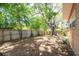 The expansive backyard offers a privacy fence and mature trees, providing a serene, shaded outdoor space at 7401 11Th N Ave, St Petersburg, FL 33710