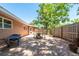Cozy backyard featuring a brick patio, charming seating area, and a well-maintained wooden fence for added privacy at 7401 11Th N Ave, St Petersburg, FL 33710